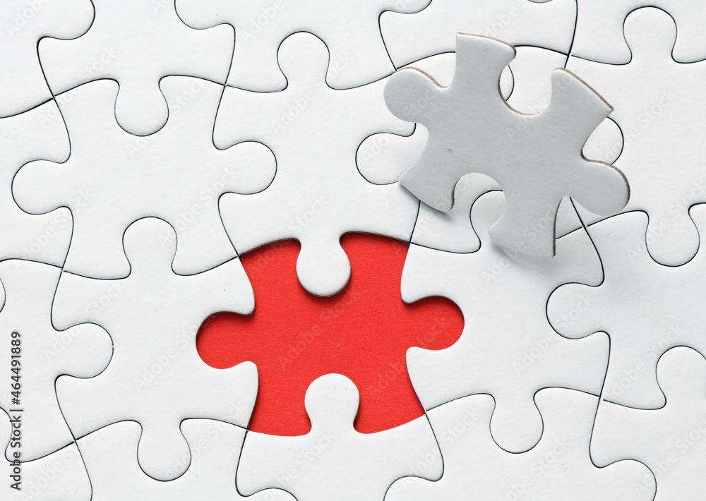 Red jigsaw puzzle pieces on red background. Copy space and business concept Red jigsaw puzzle pieces on red background. Copy space and business concept