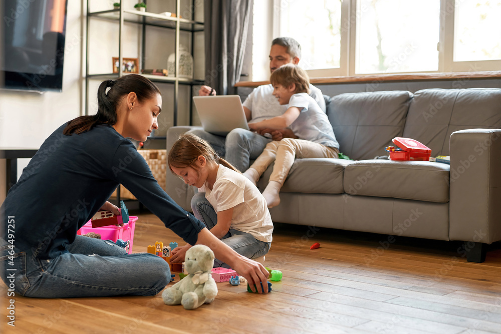 Young Caucasian family relax at home with kids Young Caucasian family relax at home with kids