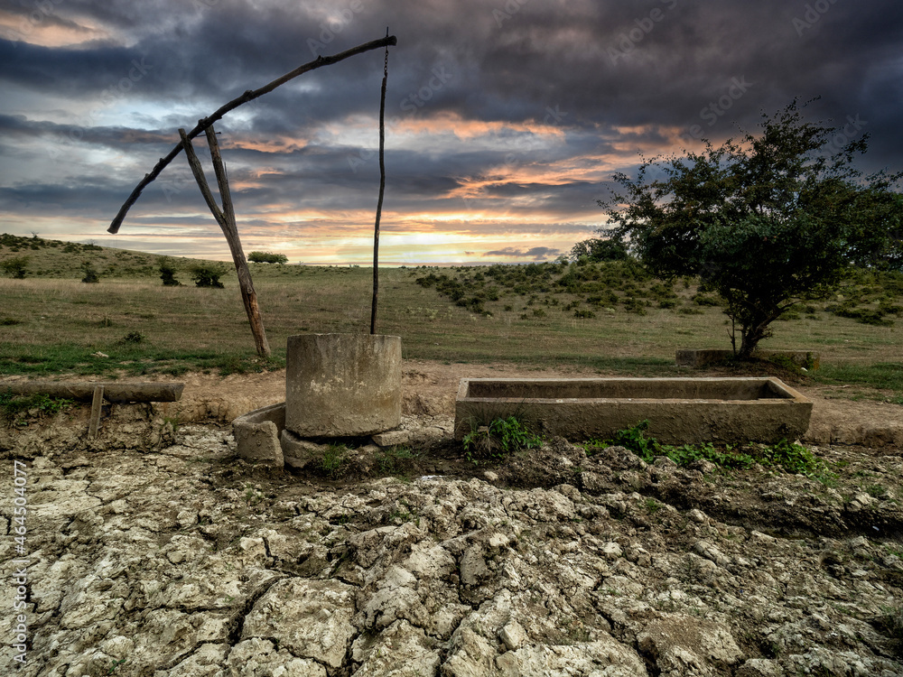 Old watering place for cattle in hungary in beautiful landscape at sunset, Old watering place for cattle in hungary in beautiful landscape at sunset,