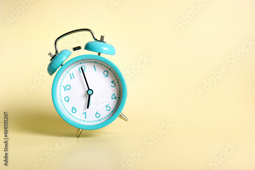 Alarm clock on a colored background
