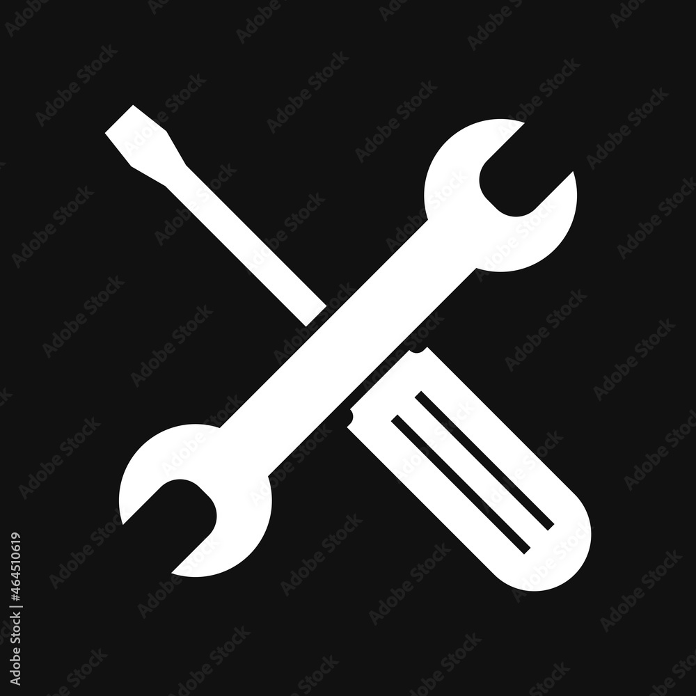 Wrench and screwdriver, repair icon on grey background Wrench and screwdriver, repair icon on grey background