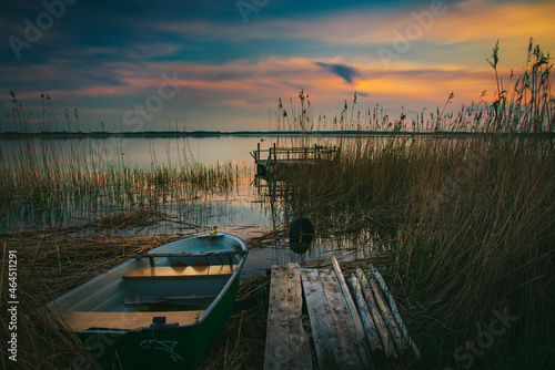 Fototapeta Naklejka Na Ścianę i Meble -  sunset on the lake and boat in wytyckie lake, poland lubelskie