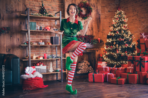 Full length photo of young positive woman elf christmas good mood winner celebrate enjoy indoors inside house home