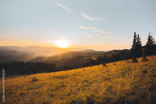 panorama of sunset in the mountains. sunbeams. rest on mountain tops. rays of the sun