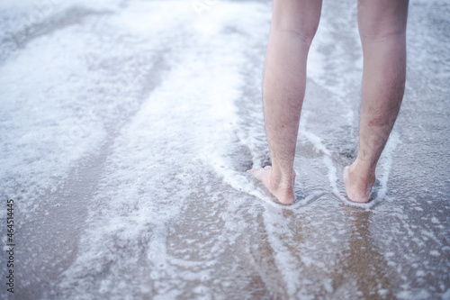enjoy the gentle lapping of the foam waves on bare feet. go to the beach to enjoy vacation time by relaxing in the sea water and sandy beaches. © freeject.net