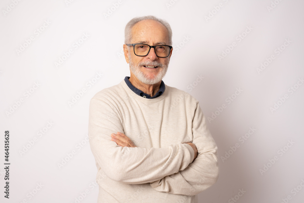 Portrait of senior man with crossed arms isolated on white Portrait of senior man with crossed arms isolated on white