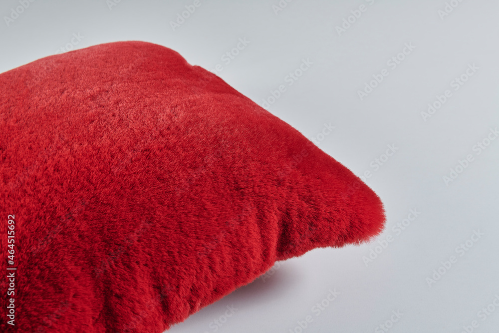 Fototapeta premium Colorful plush pillow isolated white background.
