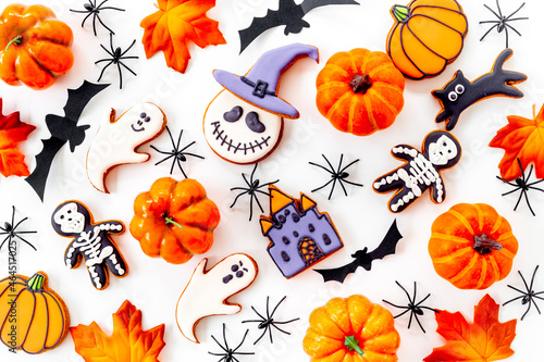 Flat lay pattern of halloween cookies and sweets. Party background