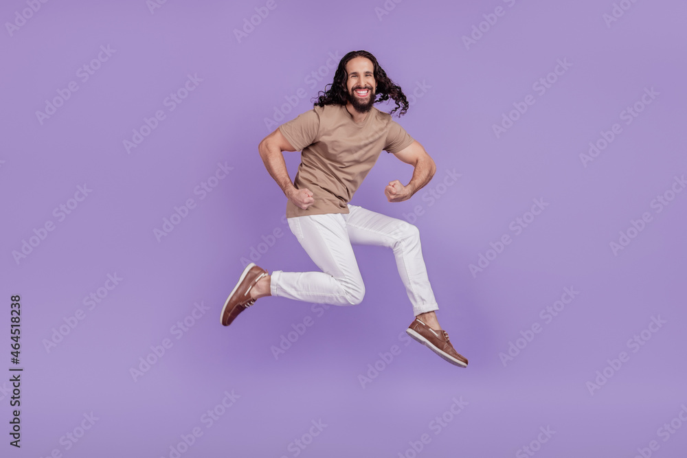 Full length photo of young latin sportsman hands muscles body care isolated on purple color background