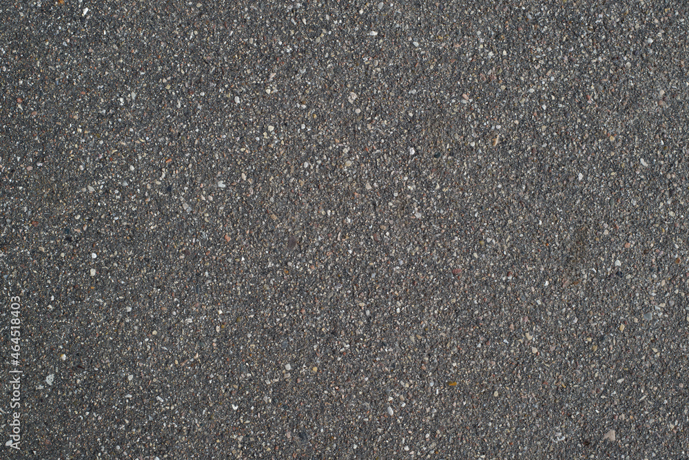 Dark gray rough asphalt, top view. Textured surface background Dark gray rough asphalt, top view. Textured surface background