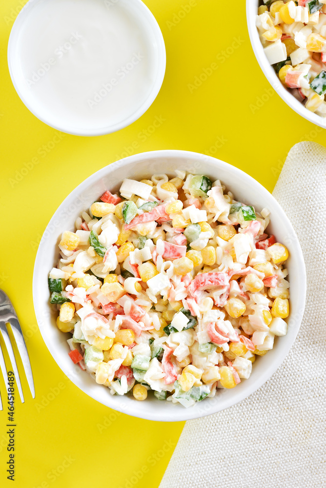Salad with crab sticks, corn, eggs, cucumber and rice Salad with crab sticks, corn, eggs, cucumber and rice