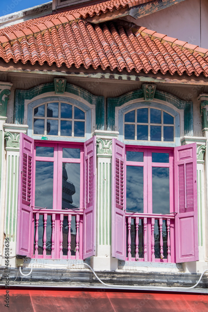 The colorful windows of the Islam style house in Arab street of Singapore. Visitors who enjoy a little bargaining will find it here among the historic shops selling textiles, perfume and more.