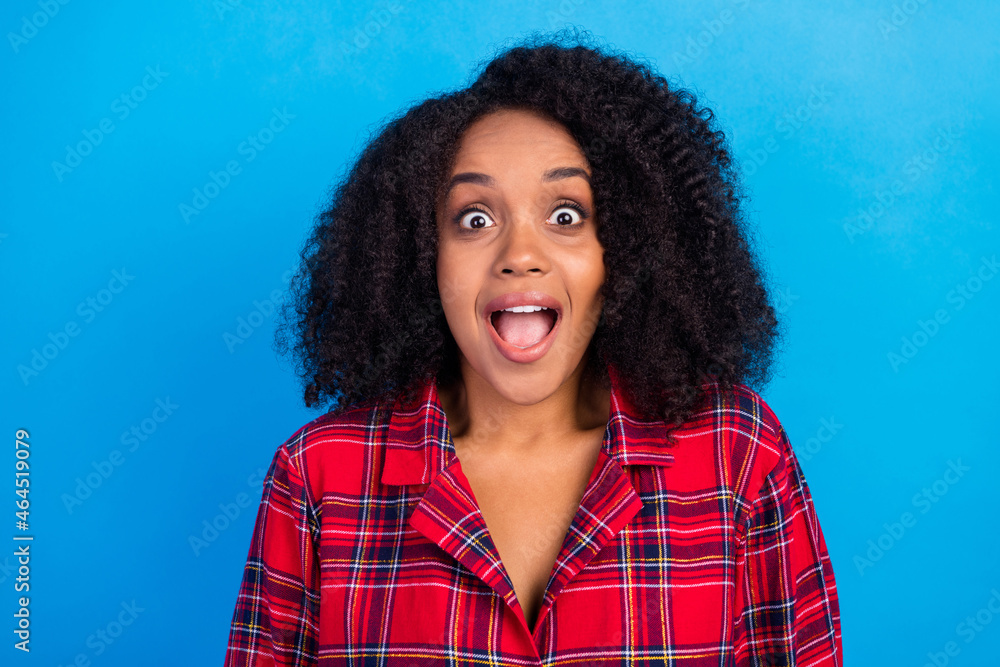 Photo of hooray brunette hairdo millennial lady staring wear red checkered pajama isolated on blue color background Photo of hooray brunette hairdo millennial lady staring wear red checkered pajama isolated on blue color background
