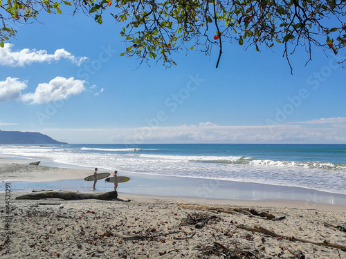 Canvastavla Sufers on the beach of Santa Teresa, Costa Rica.