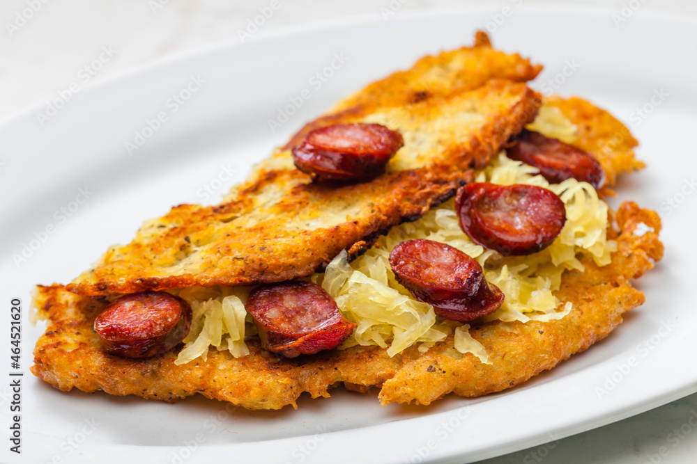 potato pancake filled with cabbage and sausage potato pancake filled with cabbage and sausage