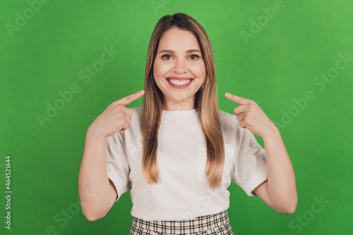 Photo of candid lady directing forefingers beaming white smile wear casual clothes
