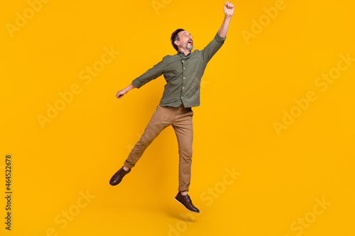 Bilde på lerret Full length body size view of attractive cheery dreamy man jumping holding copy