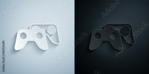 Paper cut Game controller or joystick for game console icon isolated on grey and black background. Paper art style. Vector