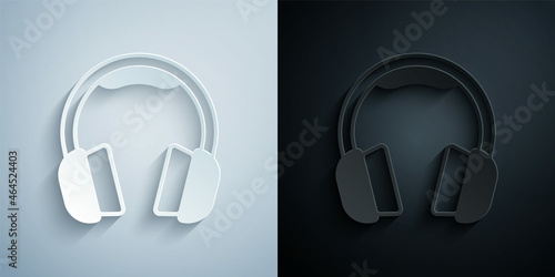 Paper cut Headphones icon isolated on grey and black background. Earphones. Concept for listening to music, service, communication and operator. Paper art style. Vector