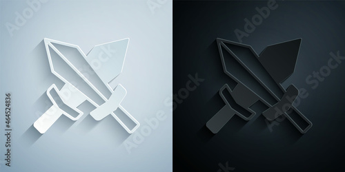 Paper cut Sword for game icon isolated on grey and black background. Paper art style. Vector