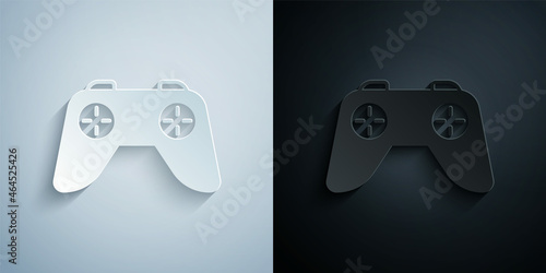 Paper cut Game controller or joystick for game console icon isolated on grey and black background. Paper art style. Vector