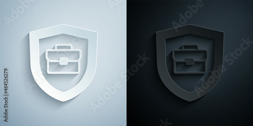 Paper cut Briefcase with shield icon isolated on grey and black background. Insurance concept. Security, safety, protection, protect concept. Paper art style. Vector