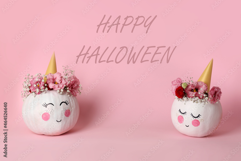 Happy Halloween composition with pumpkins on pink background Happy Halloween composition with pumpkins on pink background
