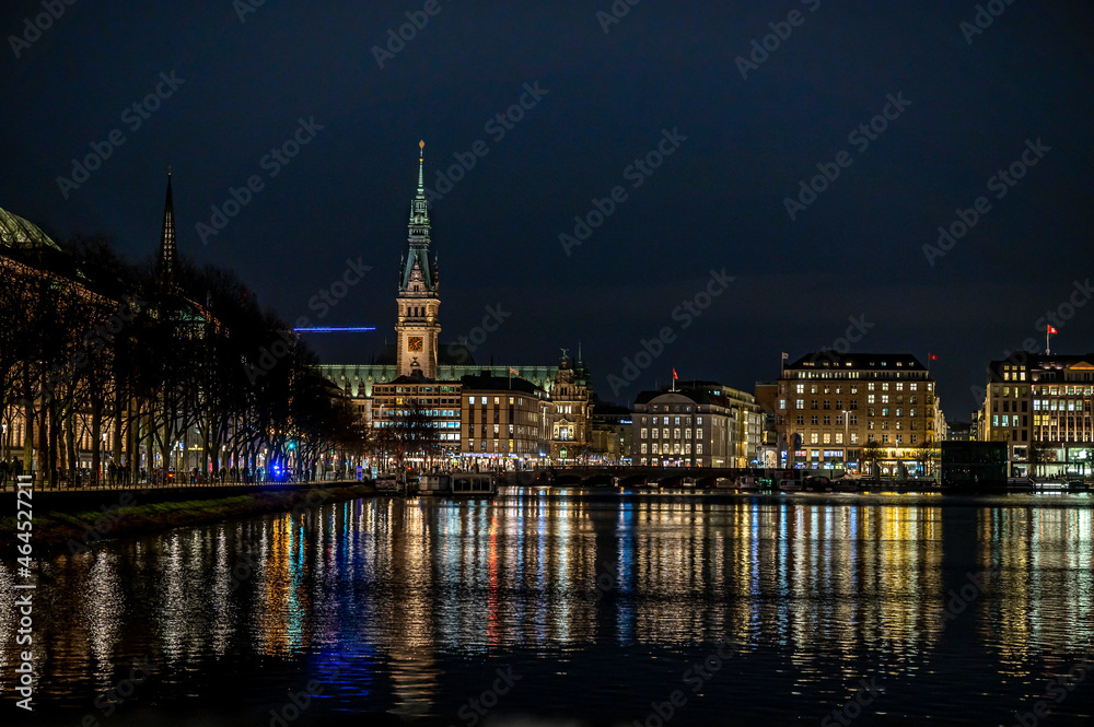 Hamburg city by night with colourful reflections in the Alster