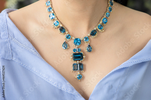 Necklace made of silver and aquamarine and gold. Elegant design for the beauty of jewelry.