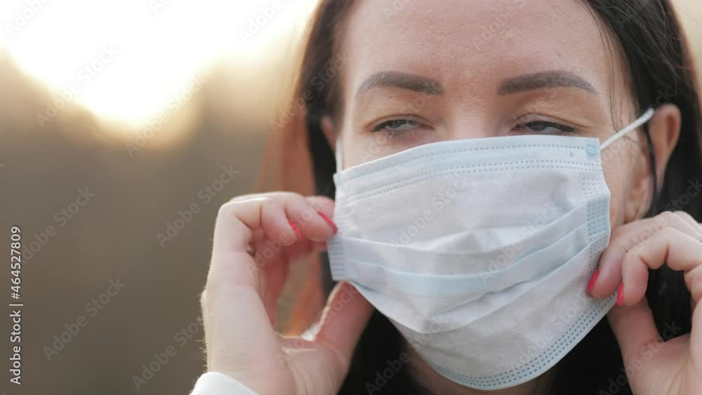 Woman with medical mask to protect her from virus. Pandemic coronavirus concept. Woman with medical mask to protect her from virus. Pandemic coronavirus concept.
