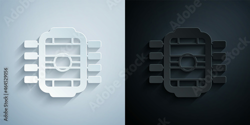 Paper cut Table football game hobby or leisure icon isolated on grey and black background. Sport team football players. Paper art style. Vector