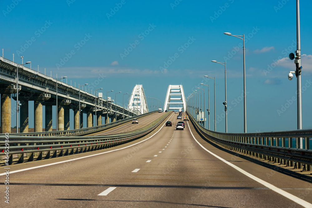 Cars go on the Crimean automobile bridge connecting the banks of the Kerch Strait: Taman and Kerch, Crimea.