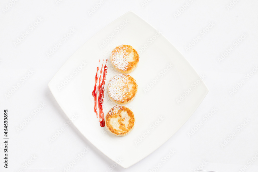 Three cheesecakes on a plate.