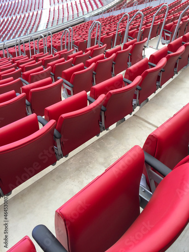 Rows of empty red seats in the stadium.