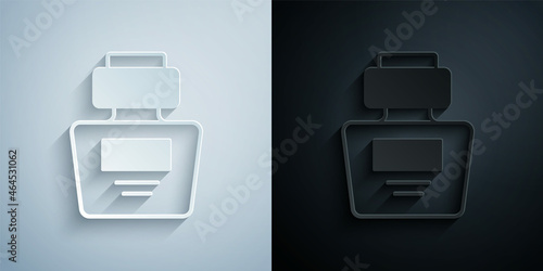 Paper cut Perfume icon isolated on grey and black background. Paper art style. Vector