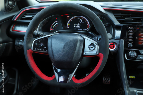 Close-up shot of a no brand steering wheel. © artographer34