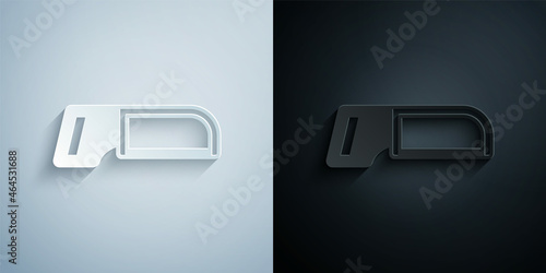 Paper cut Hacksaw icon isolated on grey and black background. Metal saw for wood and metal. Paper art style. Vector