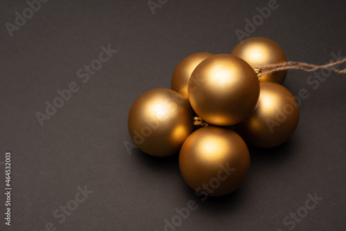 Gold Christmas balls and cones on a light blue background