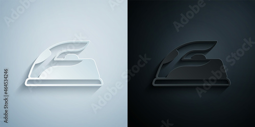 Paper cut Electric iron icon isolated on grey and black background. Steam iron. Paper art style. Vector