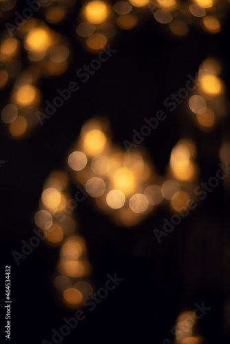 Yellow bokeh lights in the dark. Christmas garland.  © lmot11