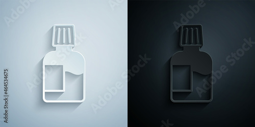 Paper cut Mouthwash plastic bottle icon isolated on grey and black background. Liquid for rinsing mouth. Oralcare equipment. Paper art style. Vector