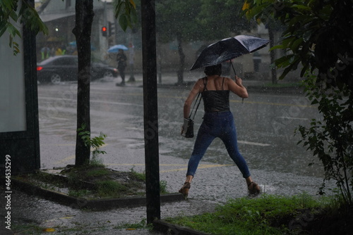 Batumi, Georgia - July 27, 2021: People walk in the rain