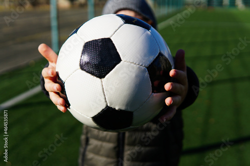 soccer ball in the hands of a child