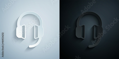 Paper cut Headphones icon isolated on grey and black background. Earphones. Concept for listening to music, service, communication and operator. Paper art style. Vector