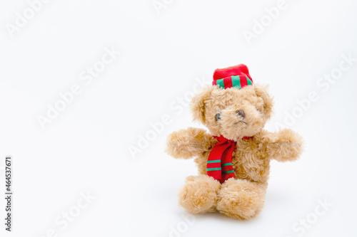 Single brown teddy bear sitting isolated on white background with copy space. The doll for children. © Chaiwat