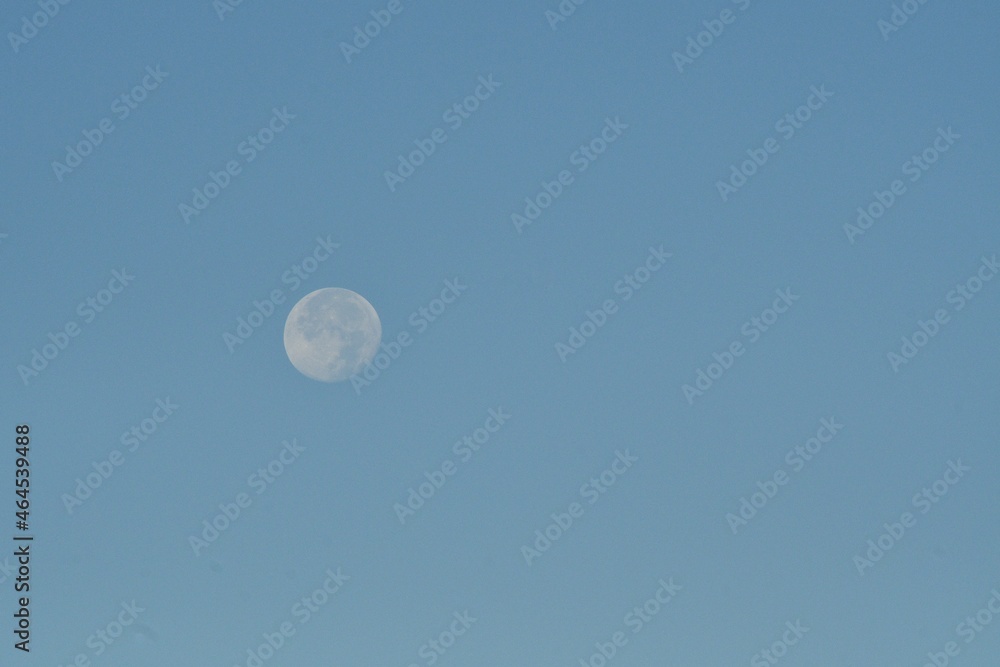 Full Moon in a Blue Sky with Text Space Full Moon in a Blue Sky with Text Space