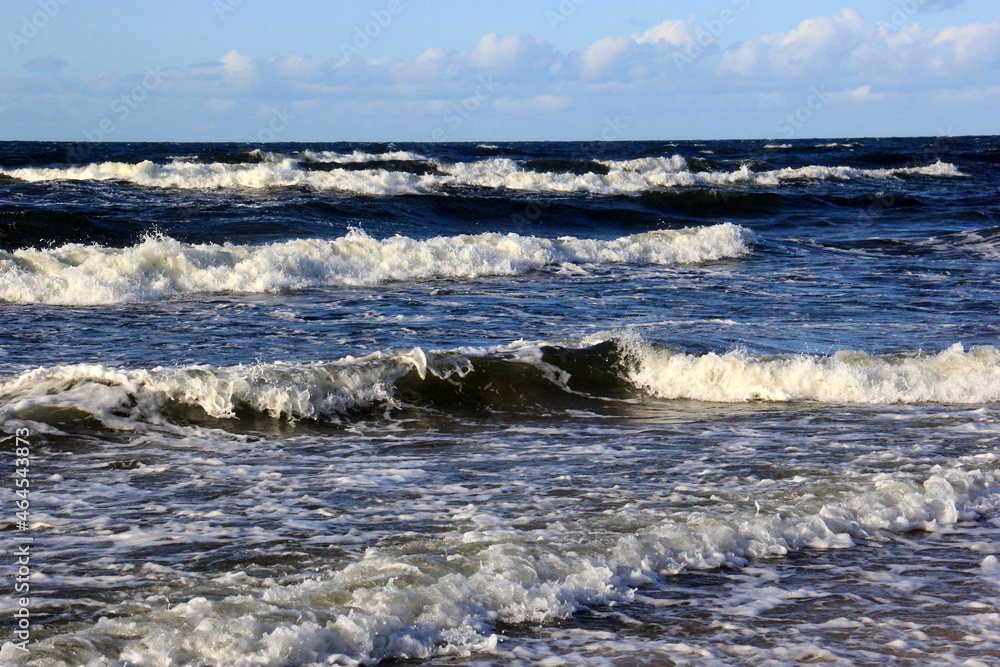 Fototapeta premium Seascape during a storm with large waves, Carnikava, Latvia. Big and powerful sea waves during the storm