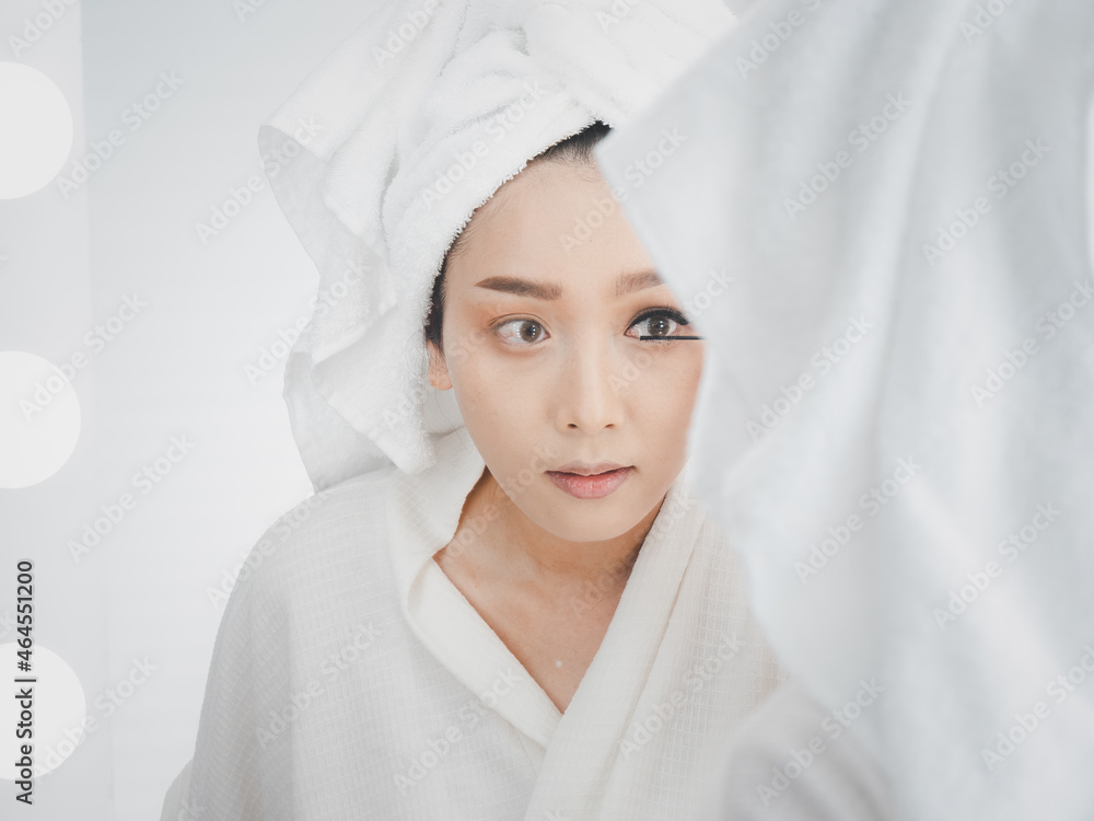 Applying mascara on lushes Asian woman getting makeup with the brush. Woman eye with beautiful makeup and long eyelashes. Applying mascara on lushes Asian woman getting makeup with the brush. Woman eye with beautiful makeup and long eyelashes.