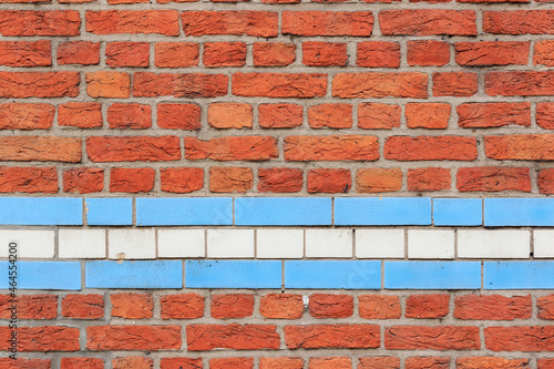 material texture of red brick wall with blue and white lines