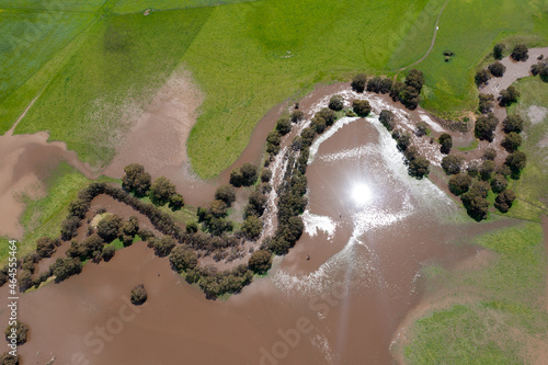 Obraz na plátne drone shot of farming landscape on a ranch in Australia, of a flooding river